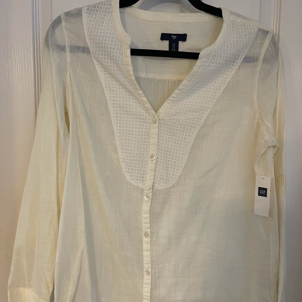 Gap Top. Size small. Beautiful detailing on front. Button sleeves. NWT.
